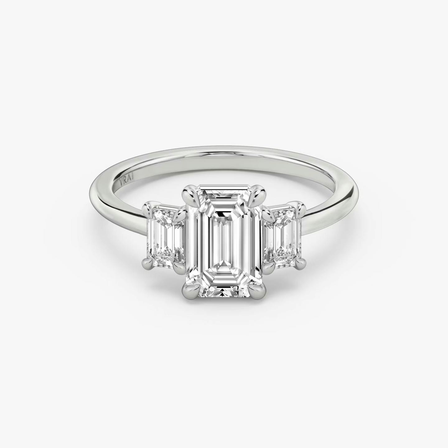The Three Stone | Emerald | Platinum | Band: Plain | Side stone carat: 1/4 | Side stone shape: Emerald | Diamond orientation: vertical | Carat weight: See full inventory